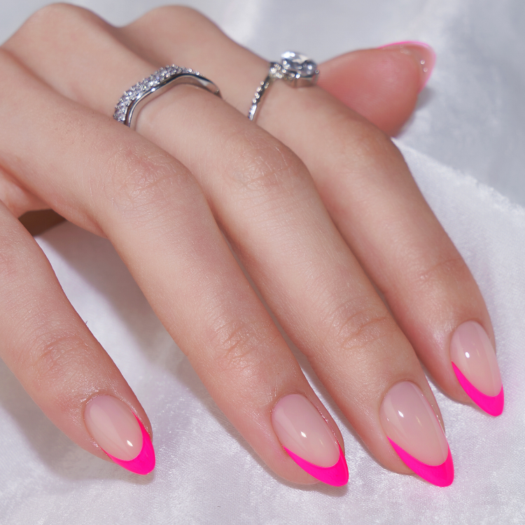 Hand showcasing good press on nails in pink French tip style