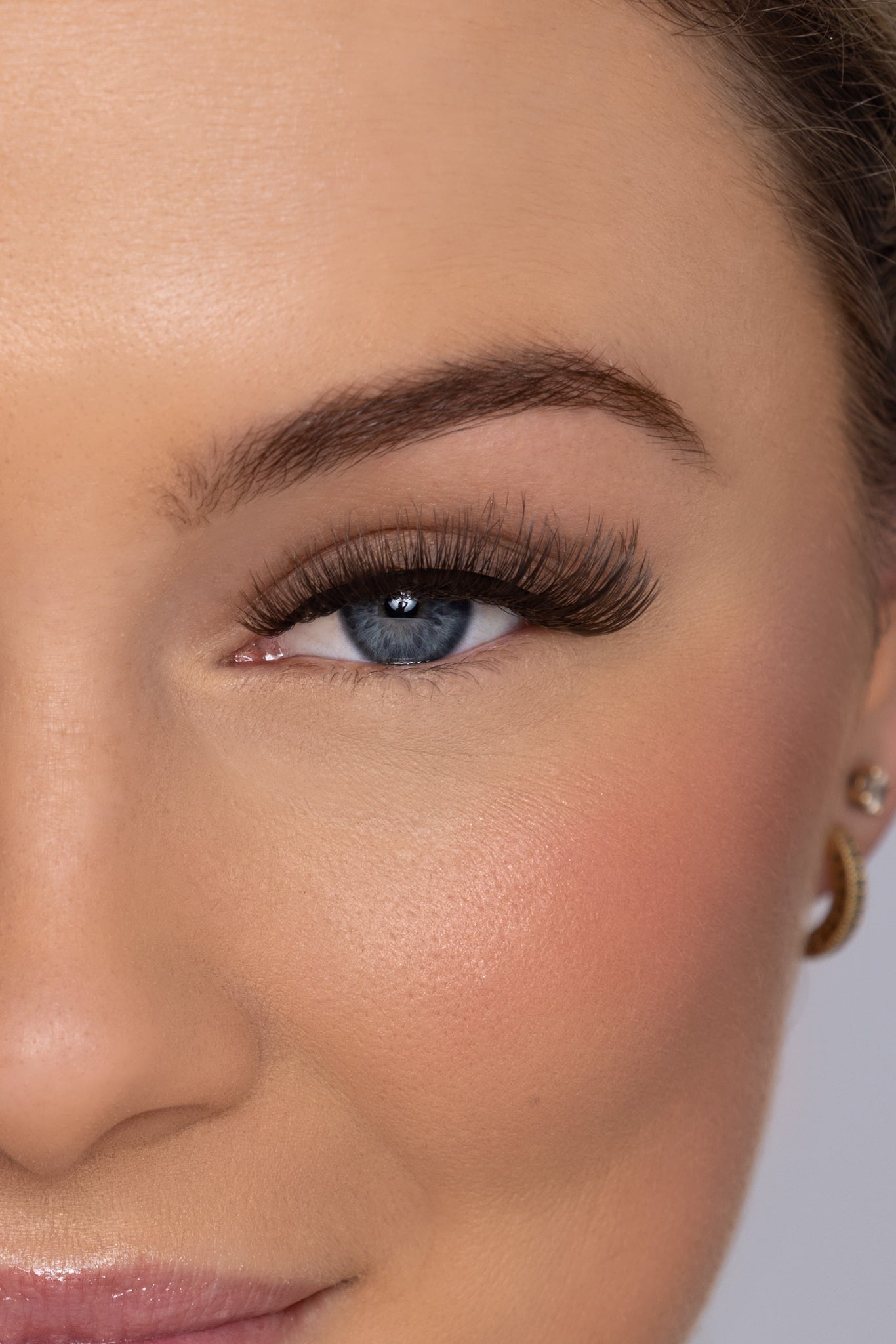 Close-up of half a woman's face with Unreal Lashez 'Bloom' style false eyelash on her eye.