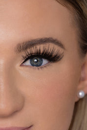 Close-up of half a woman's face with Unreal Lashez 'Wild' style false eyelash on her eye.